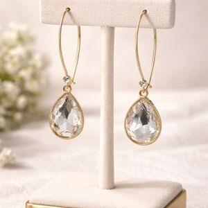 Gold-tone Earrings with Clear Crvstal Teardrop Pendants.
